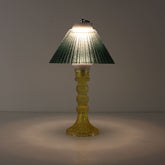 Prism battery-operated lamp (ON) with a yellow base and emerald green gradient shade for warm 3000K LED illumination.