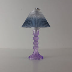 Prism glass centerpiece (OFF) with cool purple faceted base and blue gradient shade, showing modern clarity in daylight.