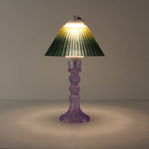 Portable wireless lantern (ON) featuring a cool purple glass base and sunlit yellow-to-green gradient shade.