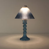 Prism rechargeable lantern (ON) with sapphire blue faceted base and matching blue gradient shade, creating a cool immersive glow.