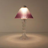 Cordless decorative table lamp (ON) with clear glass base and warm purple gradient shade for romantic ambiance.