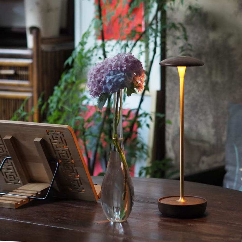 Cordless LED Table Lamp - A beautiful shot of the lamp and a vase of flowers, showcasing its aesthetic appeal.