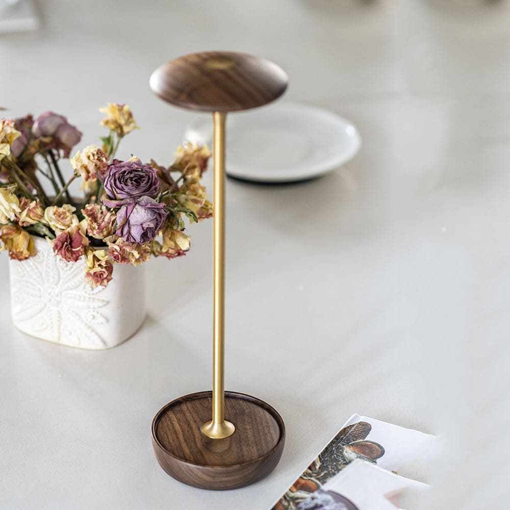 Cordless LED Table Lamp - A top-down view of the lamp's rounded head, highlighting the wood grain detail and the touch sensor.