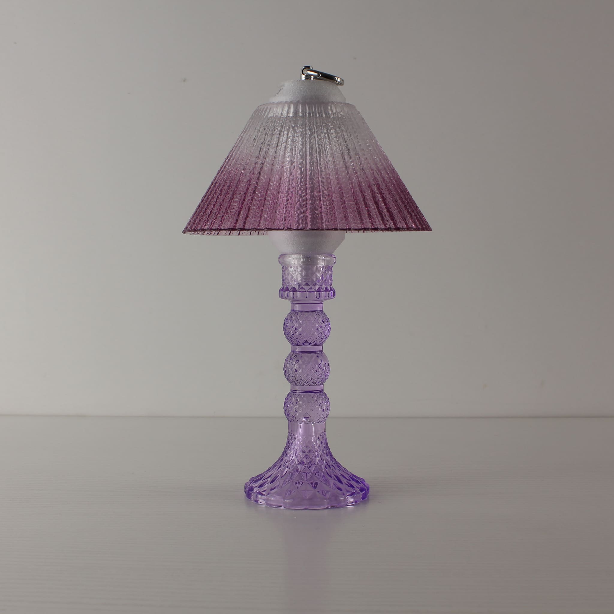 Aesthetic cool purple glass lamp (OFF) with warm purple gradient shade, highlighting the elegant amethyst-like texture.