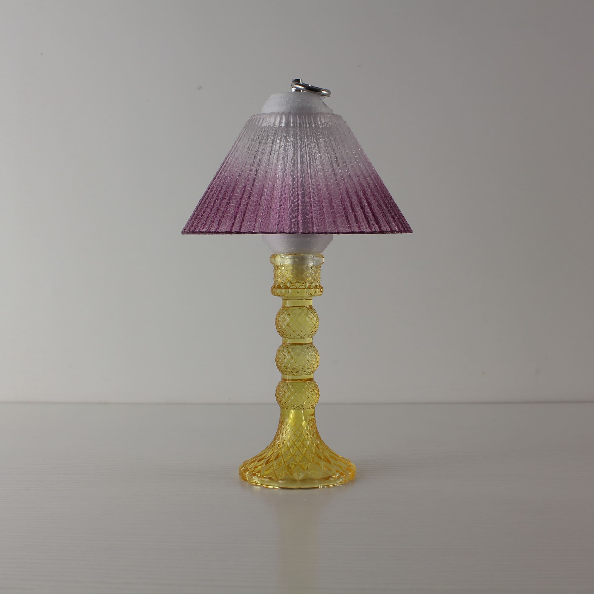 Aesthetic yellow glass lamp (OFF) with warm purple gradient shade, highlighting the elegant amber crystal-like texture.