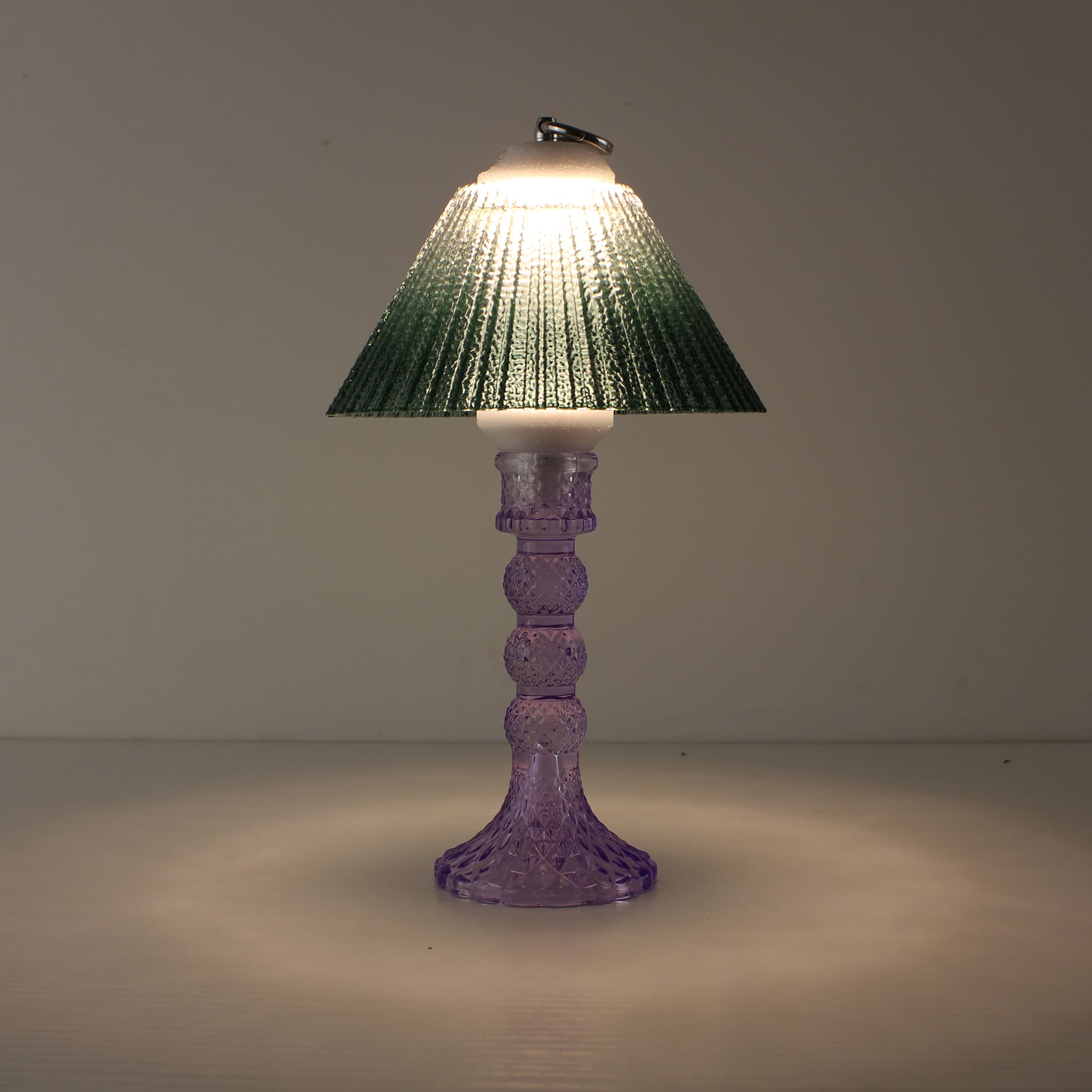 Prism battery-operated lamp (ON) with cool purple base and emerald green gradient shade for warm 3000K LED illumination.