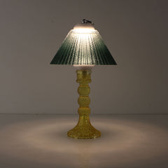 Prism battery-operated lamp (ON) with a yellow base and emerald green gradient shade for warm 3000K LED illumination.