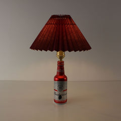 Upcycled Budweiser bottle table lamp featuring a premium burgundy pleated shade