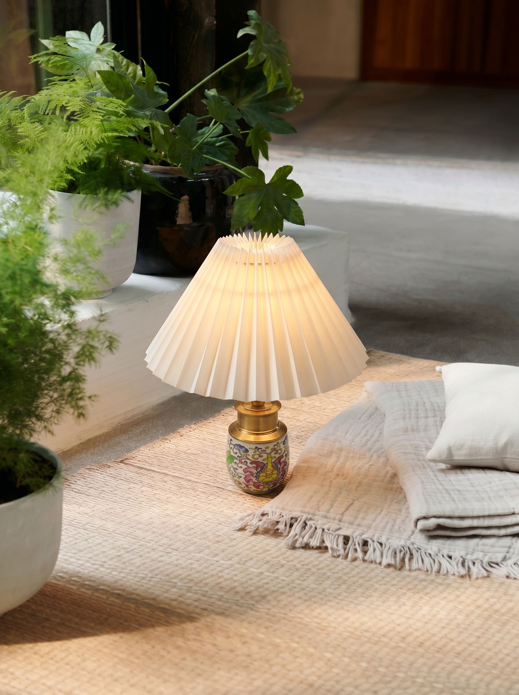 Ceramic cordless table lamp creating a warm atmosphere in a cozy reading corner