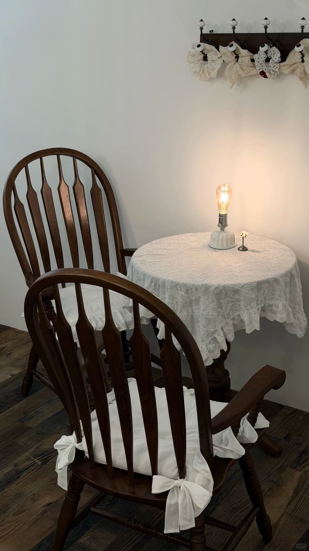 Ceramic Edison bulb table lamp adding warm ambient light to a cozy seating area