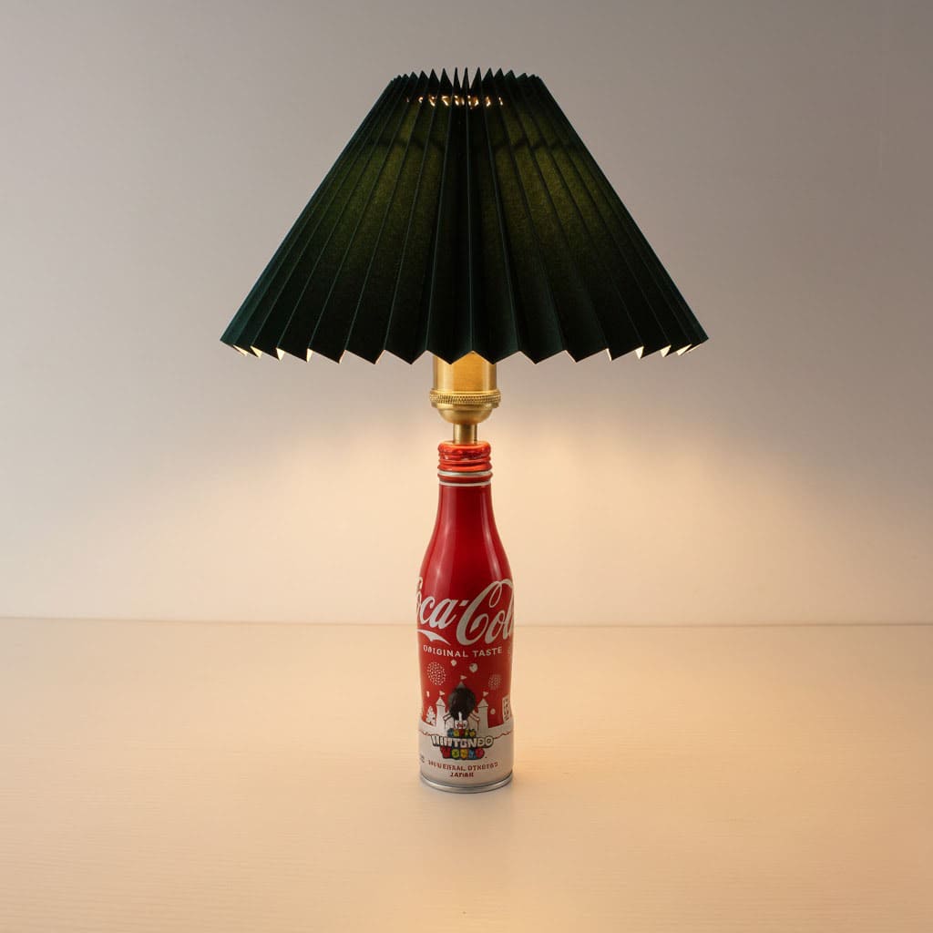 The Super Nintendo World edition lamp paired with a sophisticated dark forest green pleated lampshade.