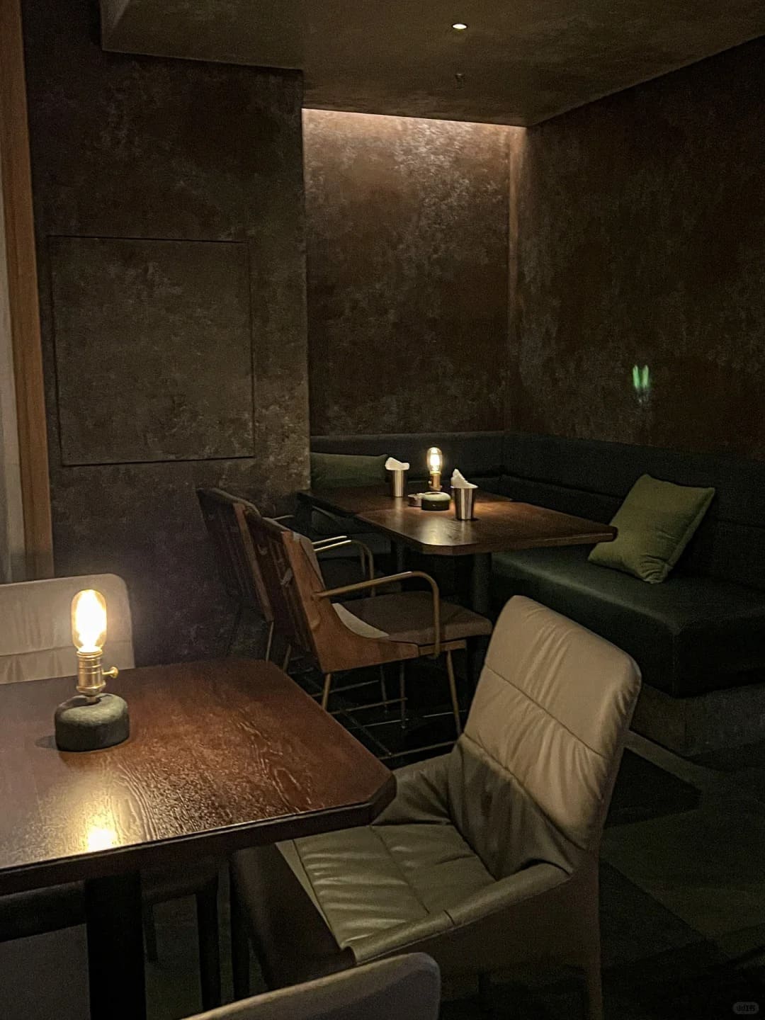 Concrete Edison cordless lamp providing warm ambient lighting in a commercial restaurant