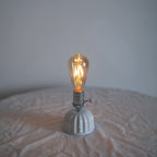 Cordless ceramic Edison bulb table lamp illuminated with vintage ST64 Edison bulb
