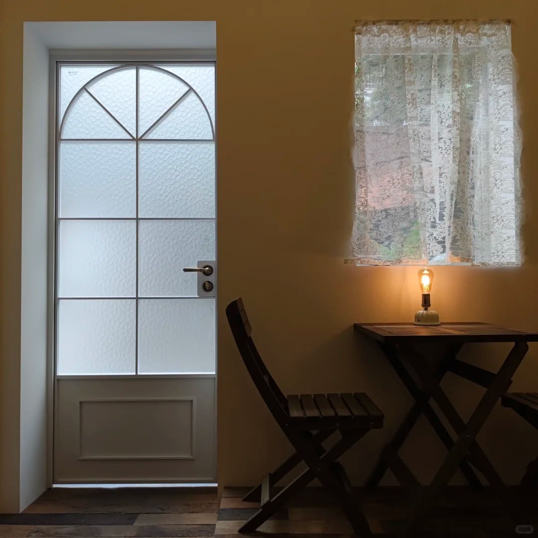 Cordless Edison bulb table lamp creating warm ambient lighting beside a window in a cozy interior