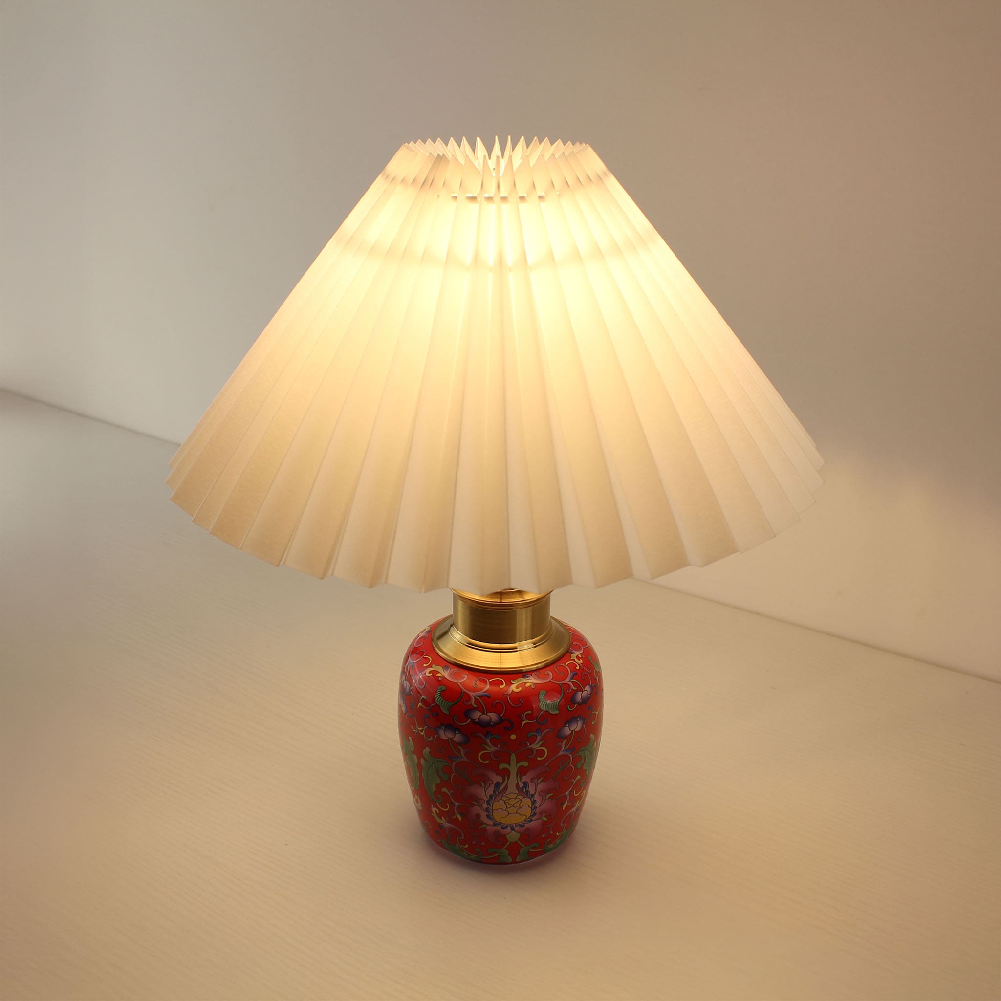 Angled view of the cordless enamel lamp with a white shade, illustrating the elegant silhouette and the warm 2700K glow