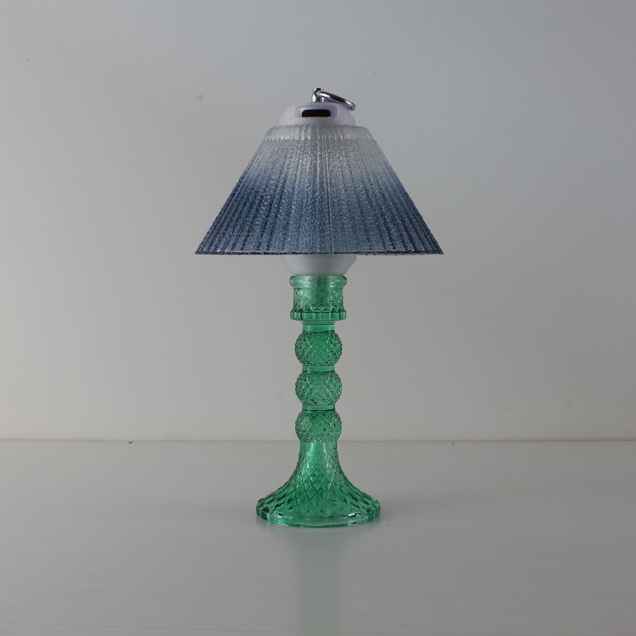 Prism glass lantern (OFF) with cyan base and blue gradient shade, showing the faceted decorative glass.