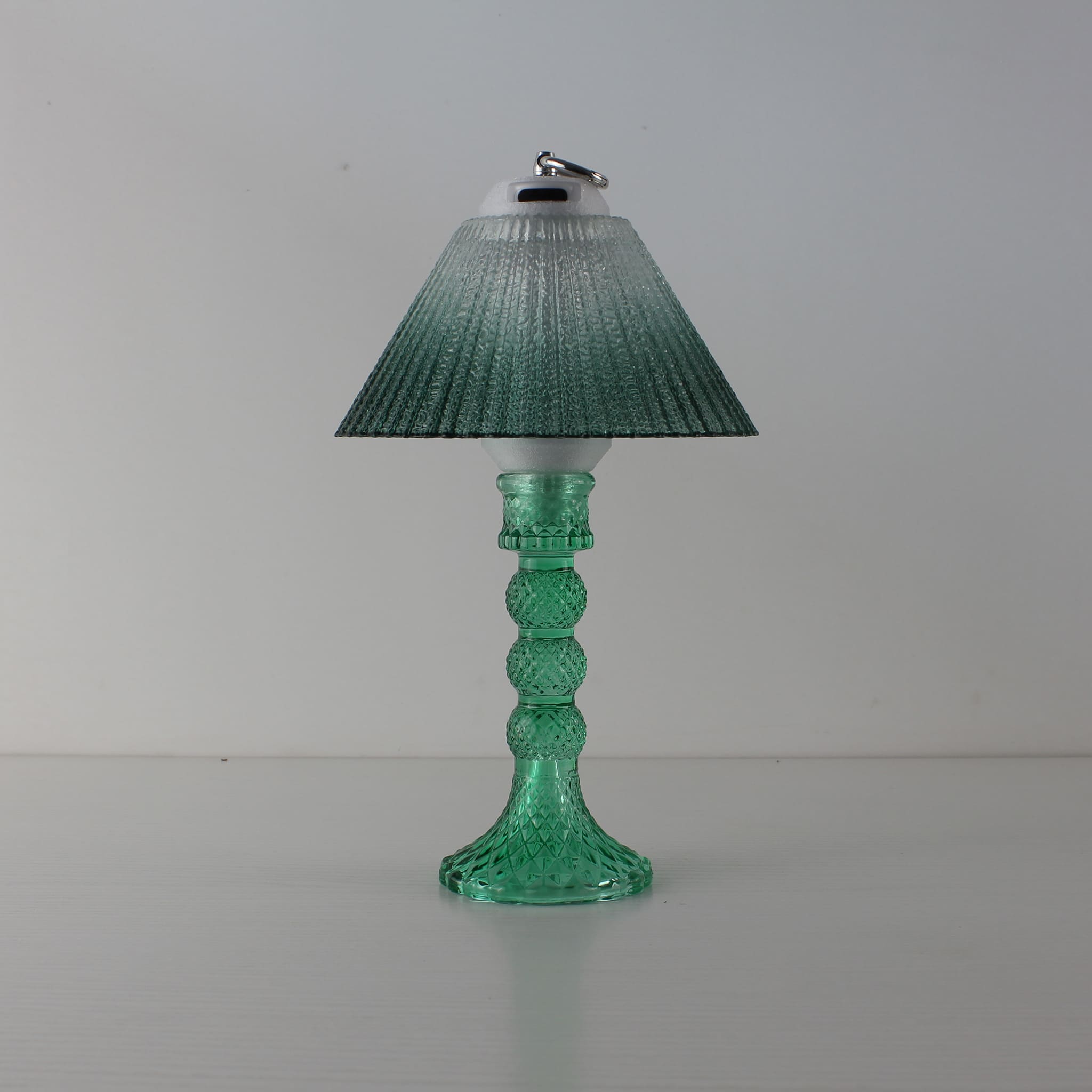 Prism portable lantern (OFF) with cyan base and clear-to-green gradient glass shade, tabletop decor.