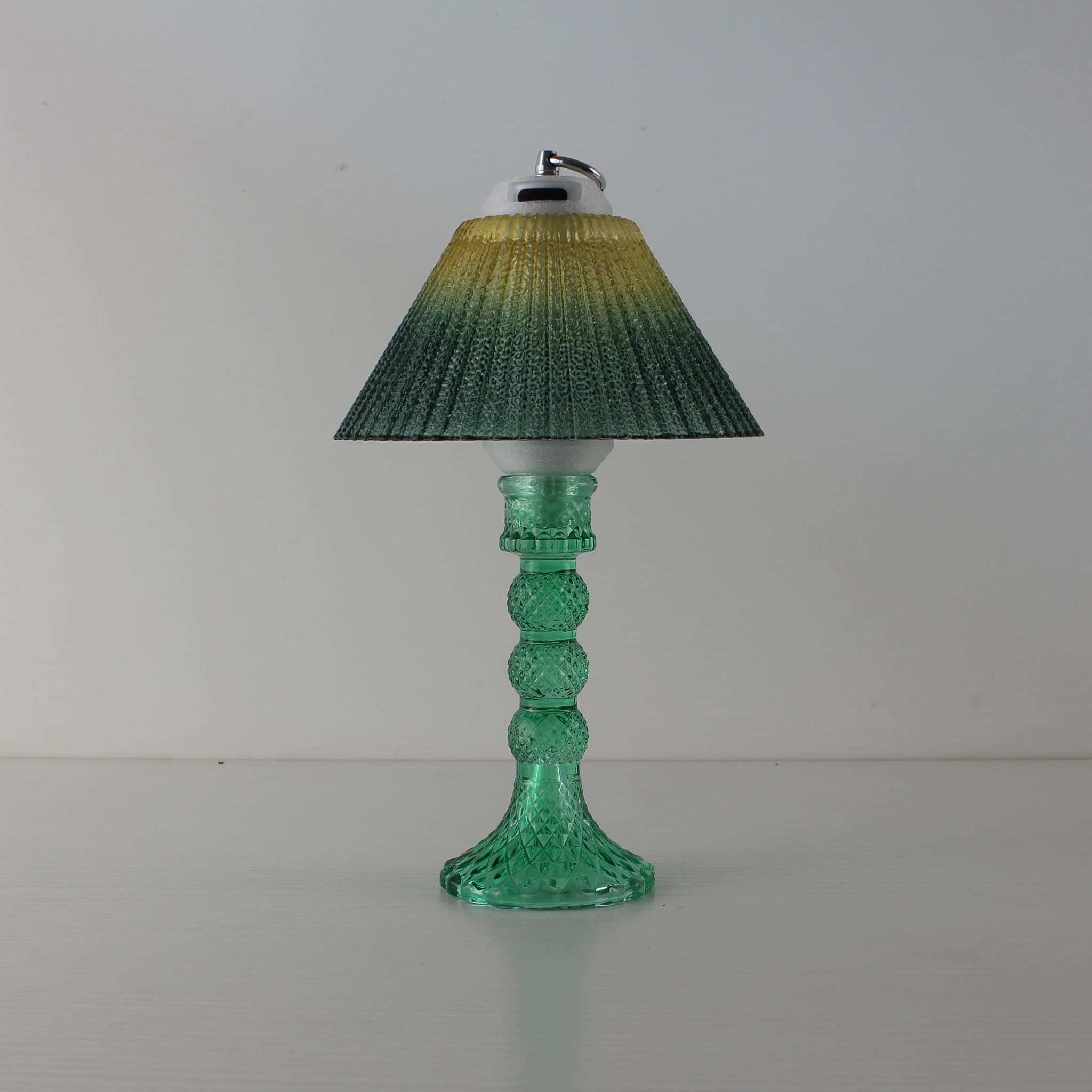 Prism aesthetic light (OFF) with cyan base and yellow-to-green gradient shade, modern home centerpiece.