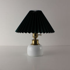 High-end ceramic cordless table lamp with a dark green pleated shade, luxury white porcelain base.