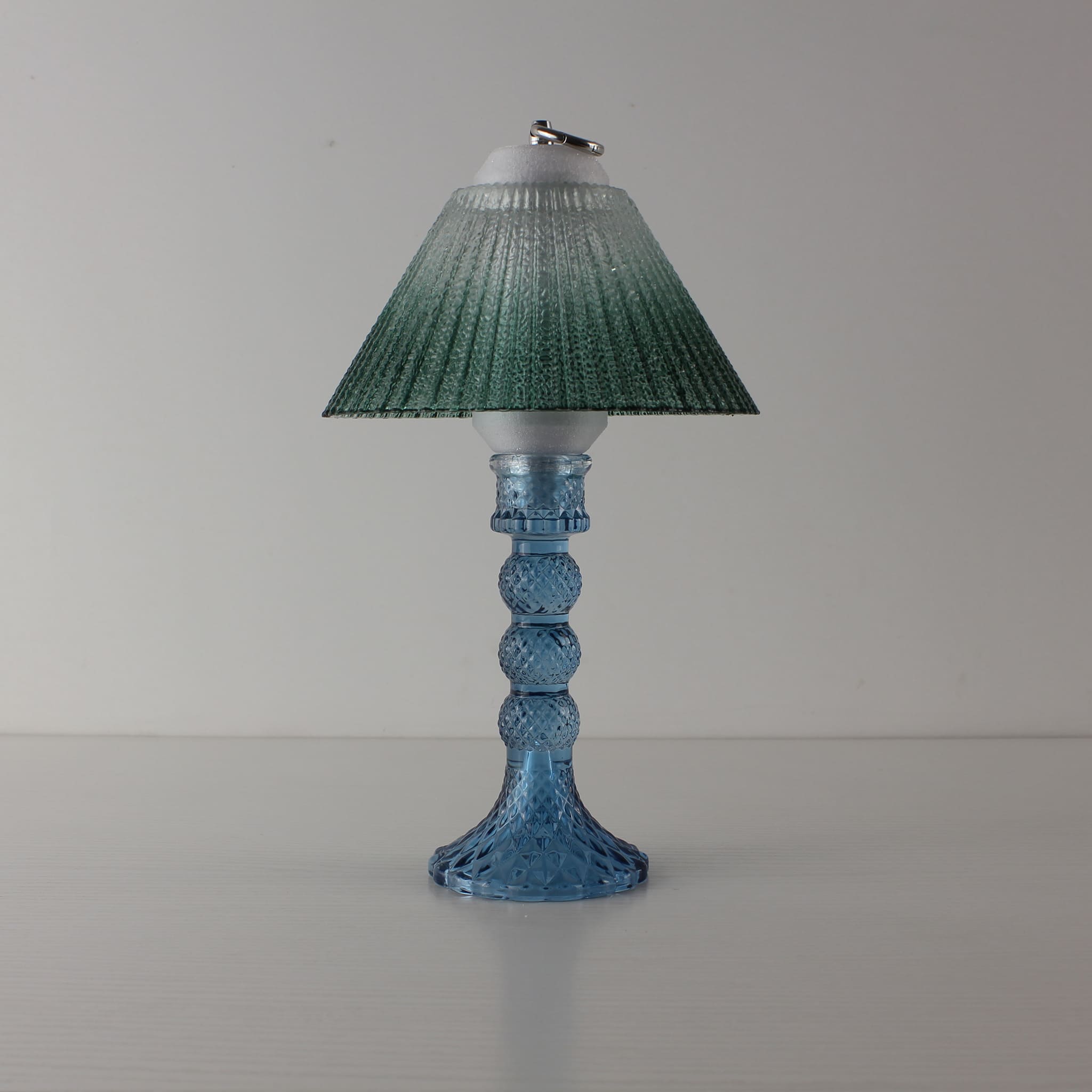 Decorative blue glass lamp (OFF) with green gradient shade, showcasing high-quality PETG 3D-printed structural details.