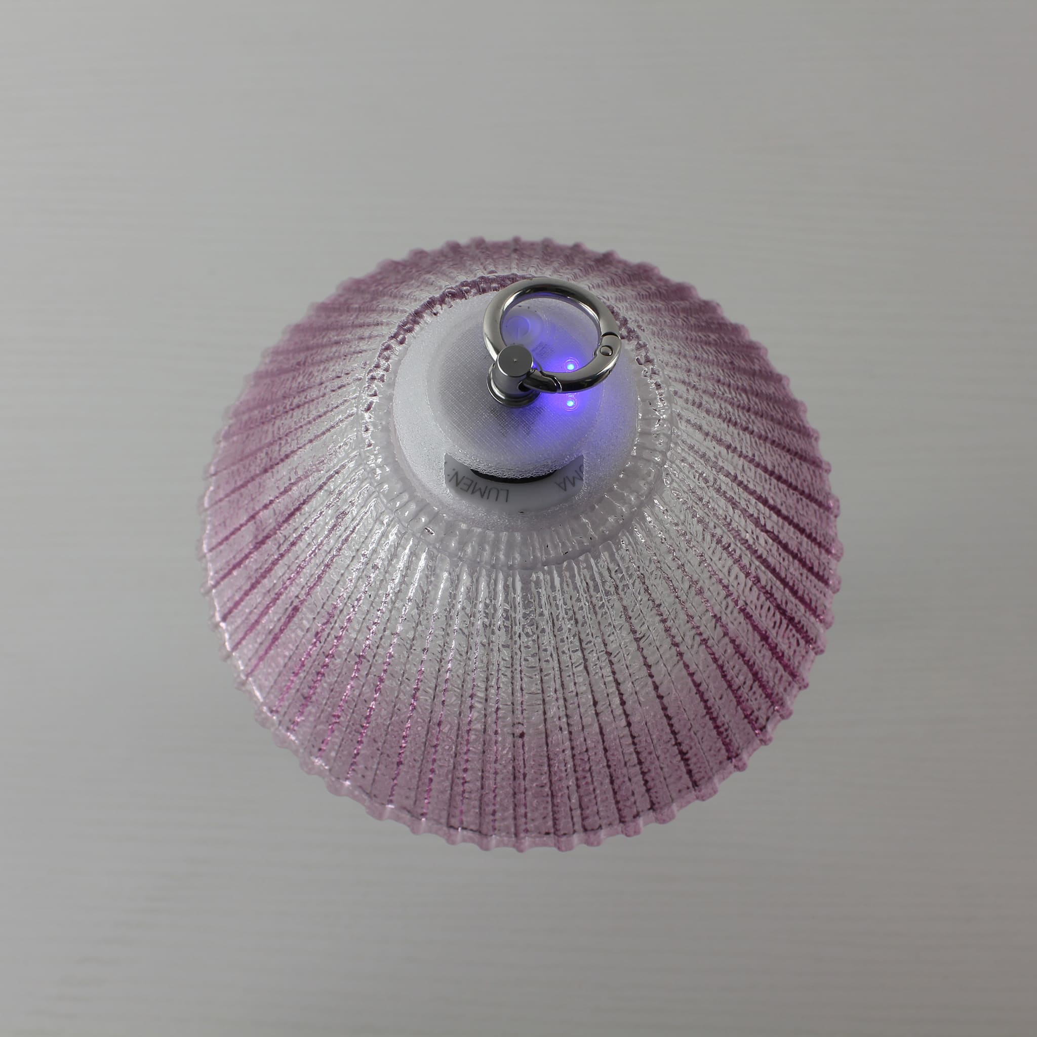 Detailed view of the Prism lantern's top showing the integrated metal hanging ring and 3D-printed PETG components.