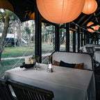 Cordless lantern illuminating a glamping dining table