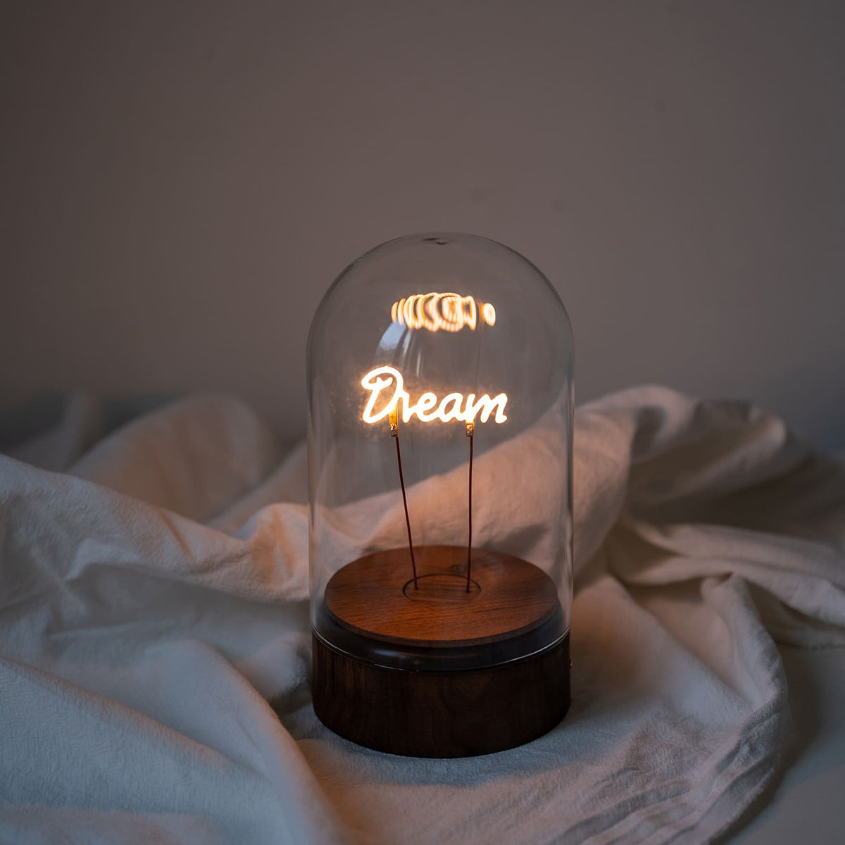 glass bell jar dream led filament word table lamp closeup