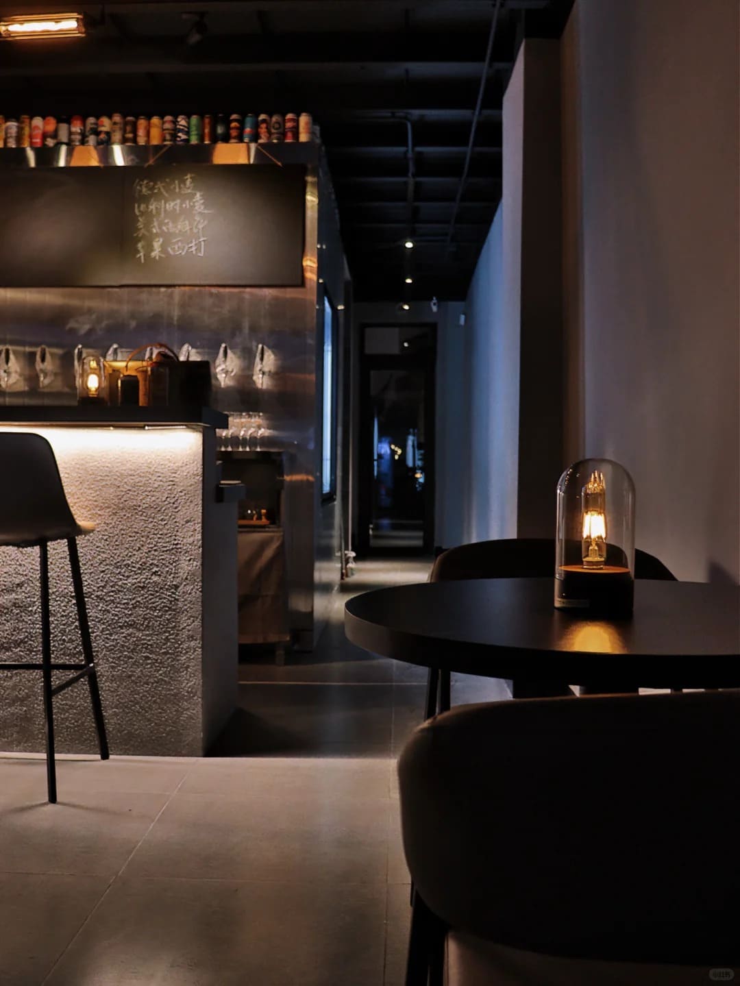 Glass dome cordless lamp illuminating a modern cafe seating area