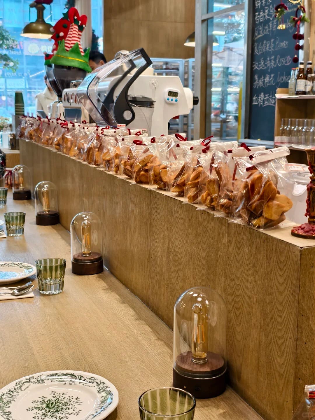 Glass dome cordless Edison lamps illuminating a bakery cafe counter