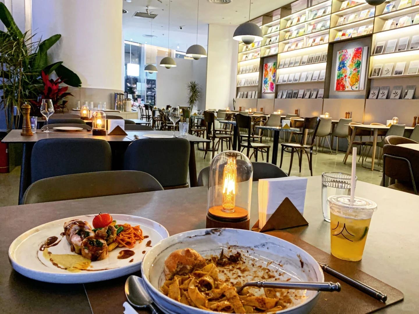 Glass dome Edison cordless lamps creating ambient lighting in a modern restaurant