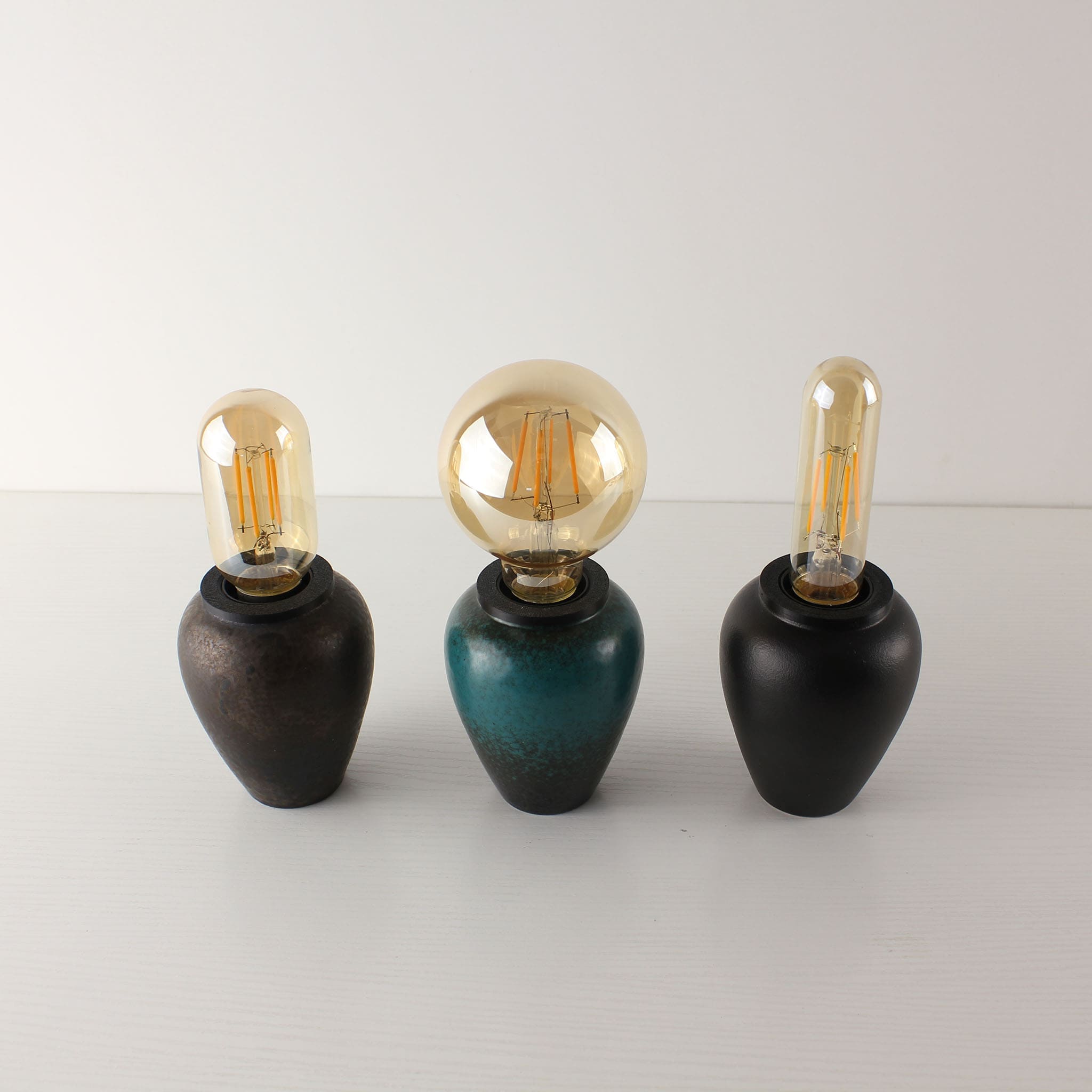 Collection of three handcrafted ceramic lamps with different bulb shapes (T45, A80, T125), illustrating the versatile Zen-style decor options