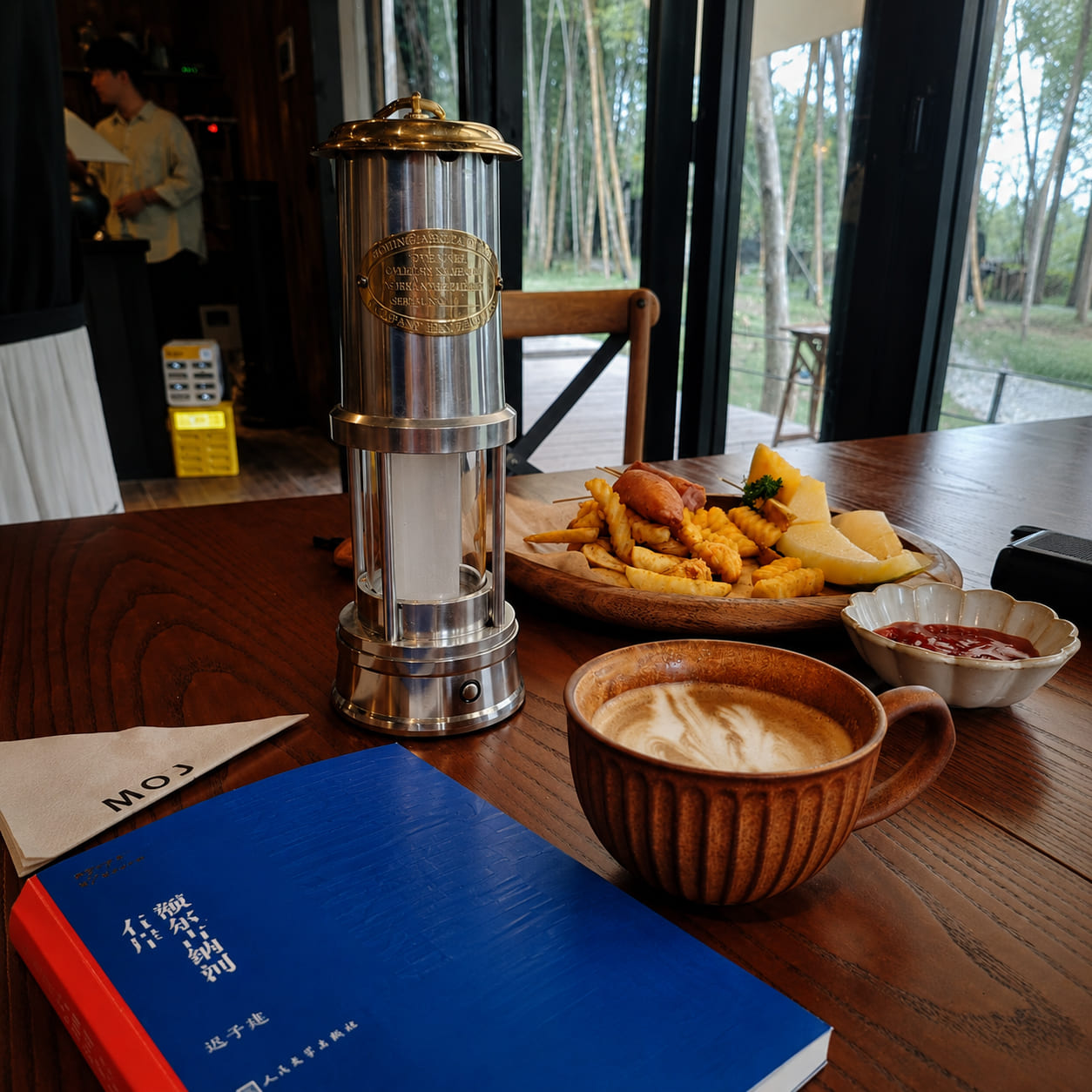 Rechargeable miner's lantern used as a reading and dining table light