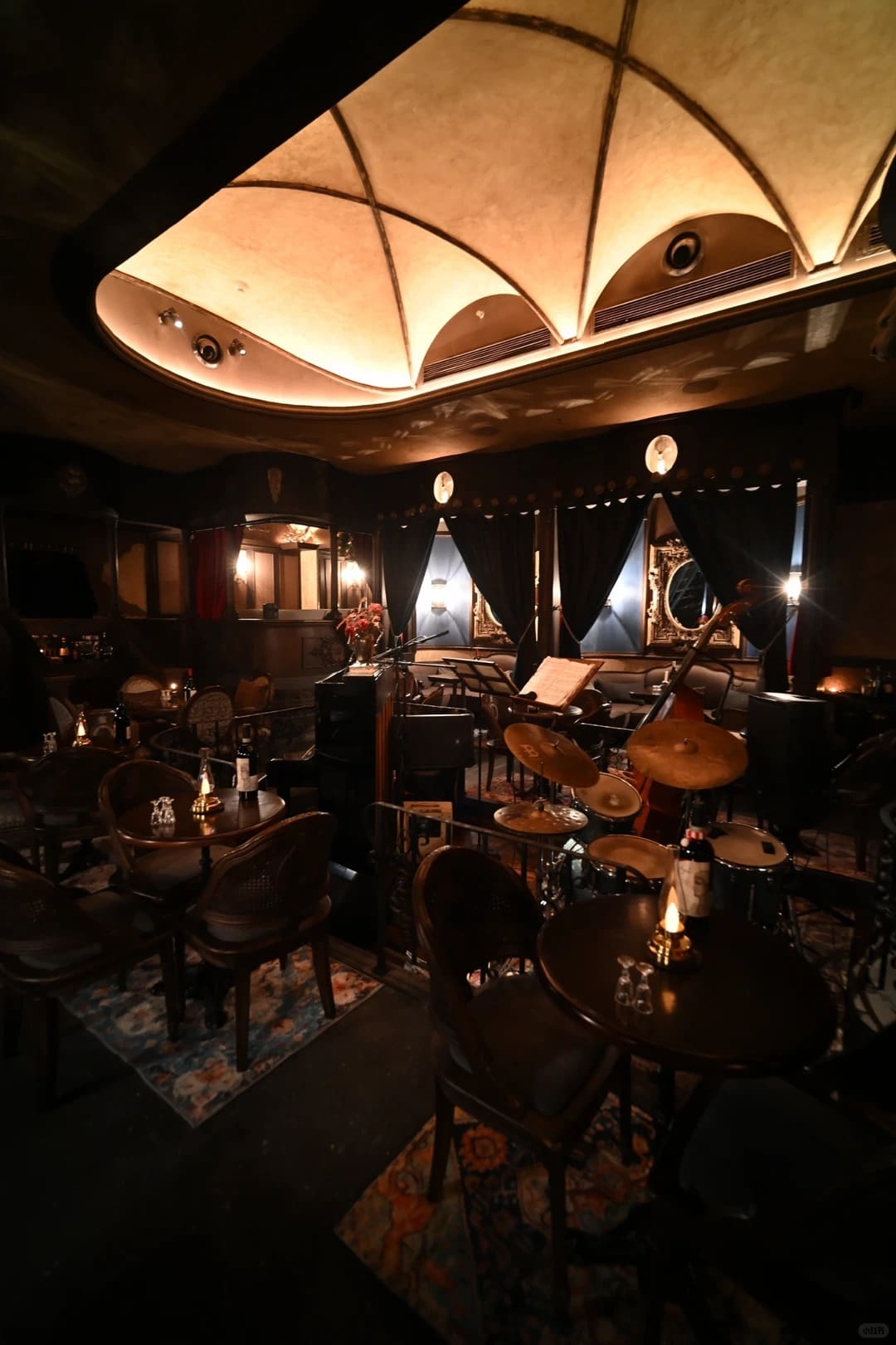 Rechargeable LED oil lamps creating warm ambient lighting in a live music restaurant