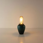 Minimalist portable desk lamp with a handcrafted green ceramic tea caddy base and a sleek T45 tube-shaped vintage LED bulb