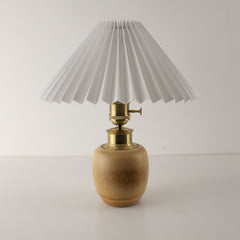 Minimalist white pleated shade lamp with natural bamboo base, battery operated cordless lighting for weddings and cafes.