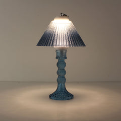 Prism rechargeable lantern (ON) with sapphire blue faceted base and matching blue gradient shade, creating a cool immersive glow.