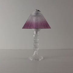 Decorative transparent glass lamp (OFF) with purple gradient shade, an elegant centerpiece for home decor.