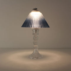 Prism rechargeable lantern (ON) with clear faceted base and blue gradient shade emitting a soft prismatic glow.