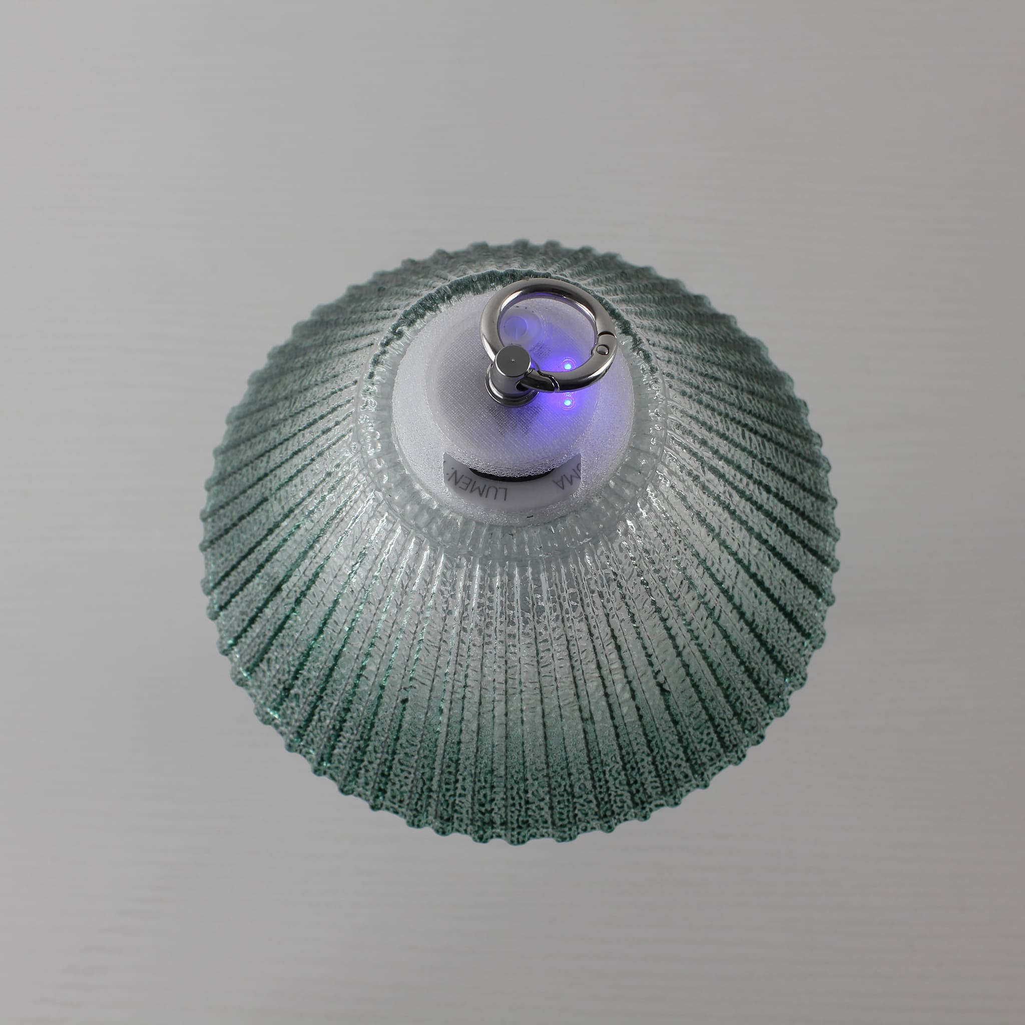 Detailed view of the Prism lantern's top showing the integrated metal hanging ring and 3D-printed PETG components.