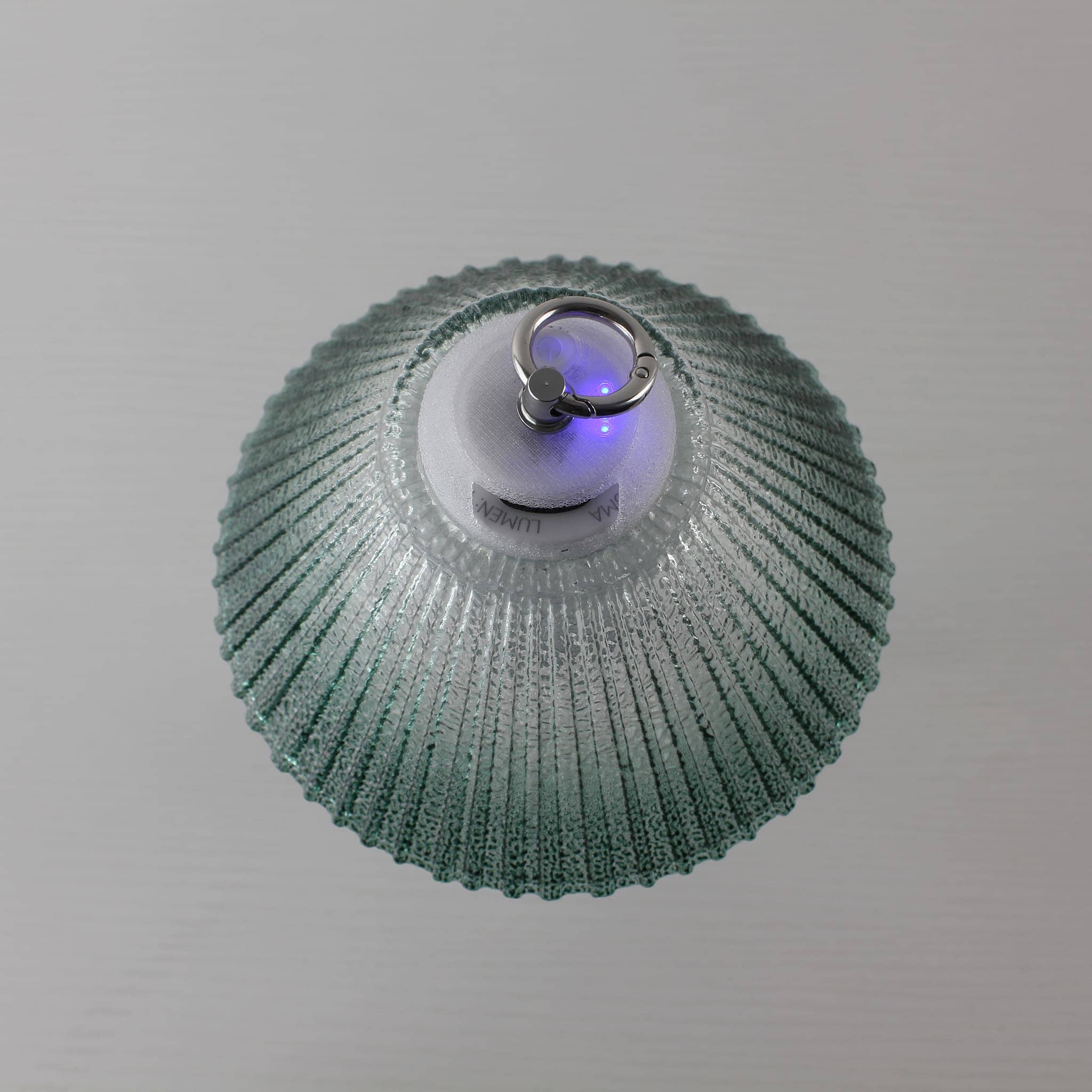 Top view of Prism lantern showing the USB-C charging port, power indicator, and metal hanging ring.