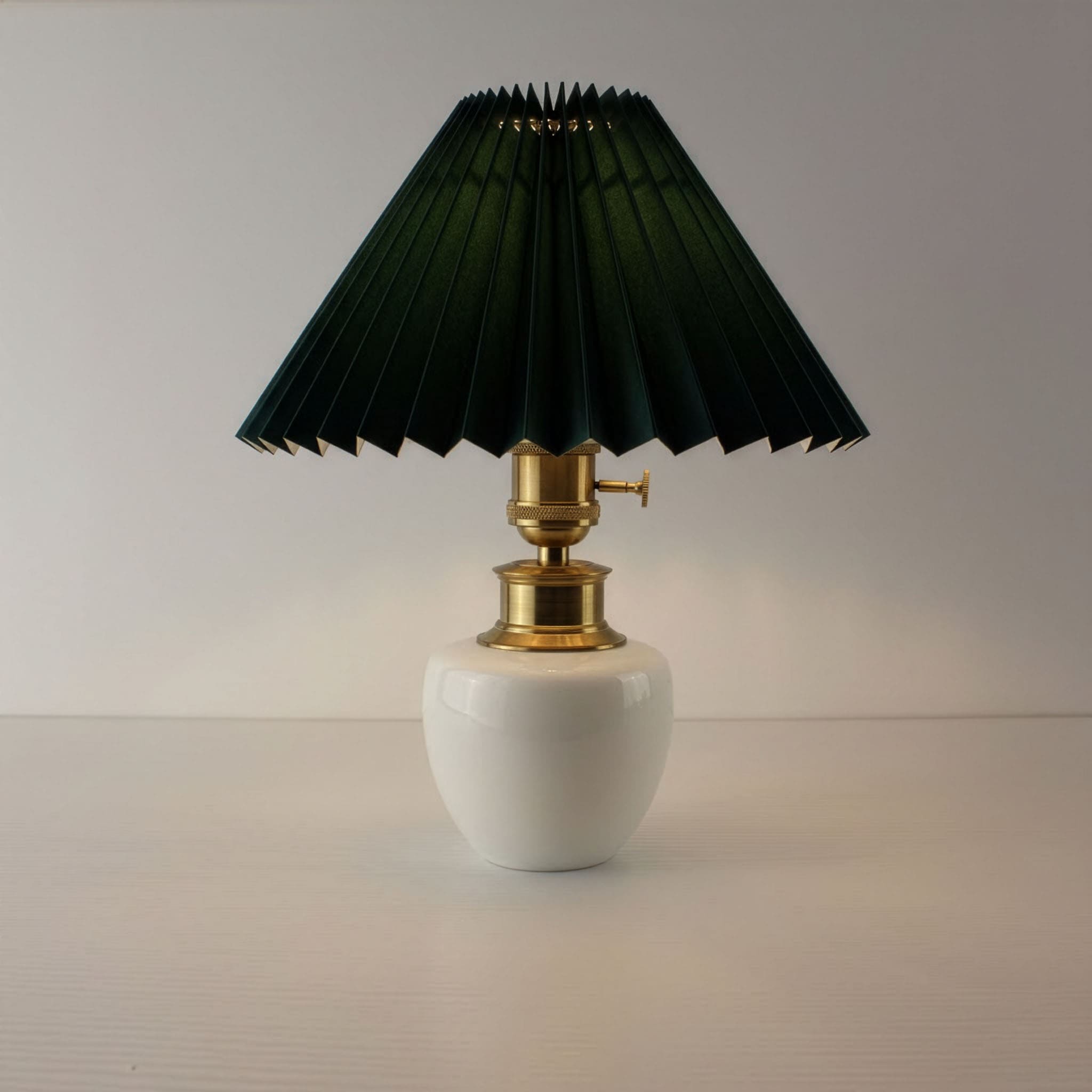 High-end rechargeable bistro lamp with dark green pleated shade, glowing warm light.