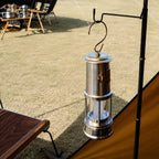 Rechargeable Davy miner's lantern hanging beside a camping tent
