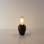 Rustic handcrafted ceramic portable lamp in industrial rust finish, featuring a compact T45 tube-shaped vintage LED bulb