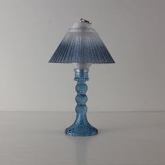 Prism glass centerpiece (OFF) with sapphire blue faceted base and blue gradient shade, showing elegant modern clarity in daylight.