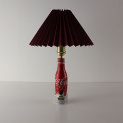 An upcycled Nintendo-themed Coca-Cola bottle lamp featuring a premium burgundy (dark red) pleated lampshade