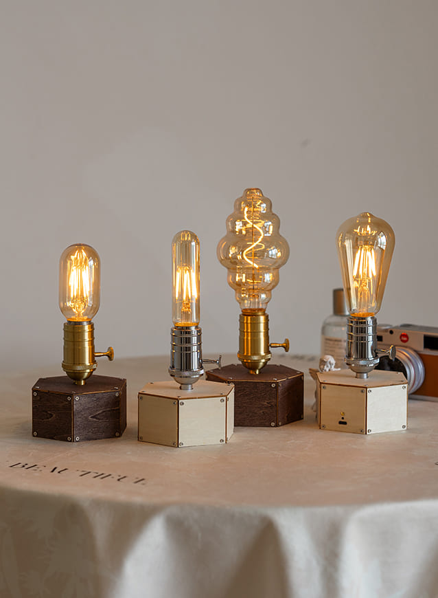 Vintage cordless Edison lamp collection showcasing unique bulb shapes and warm ambient lighting