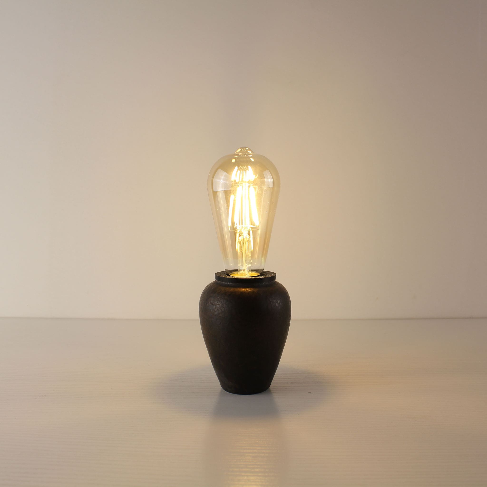 Vintage rust-colored rechargeable tea caddy lamp base paired with a classic teardrop ST64 Edison LED bulb for a retro aesthetic